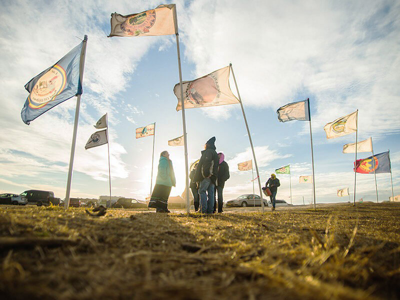 Flags fly at the Oceti Sakowin Camp near Cannonball, North Dakota