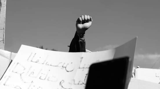 Image of a protester’s fist during the Stop Pollution demonstration